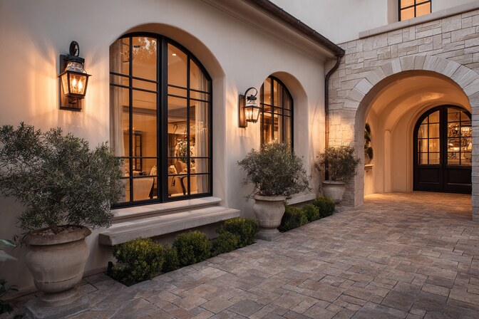 Elegant home exterior with arched windows showcasing premium Irvine, CA Windows design and installation